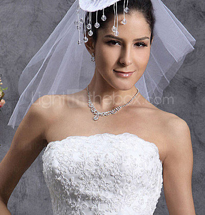 not included. A-line tea length wedding dress with sleeves. not included. A-line