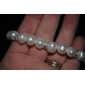 una elegante joyería de perlas de agua dulce conjunto, incluyendo el collar, pulsera y pendientes